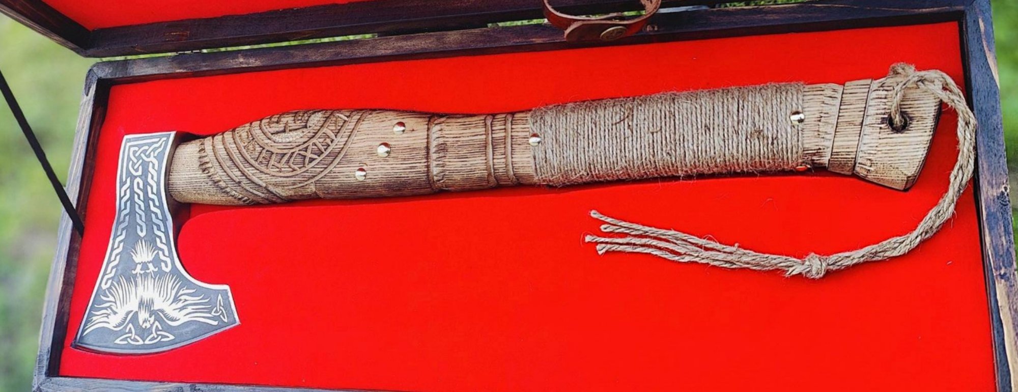 Viking bearded axe with an engraved head, carved and rope wrapped handle, in a wooden presentation box